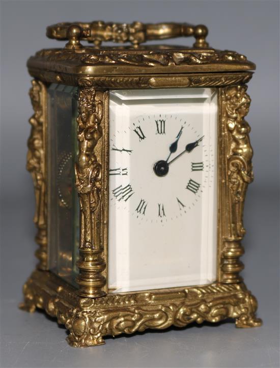 A small ornate brass time piece